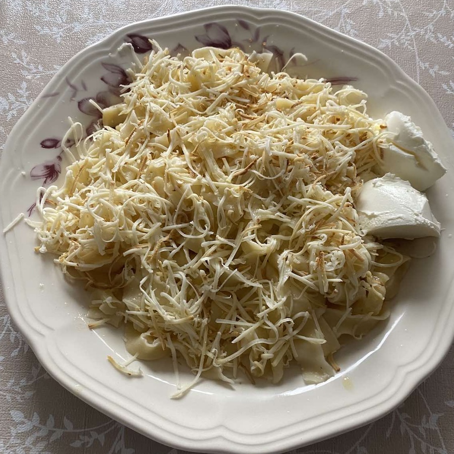 Bosnian homemade pilav prepared with butter and smoked cheese